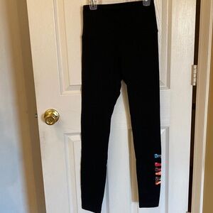 NWT Victoria’s Secret Yoga leggings. XS. Black with multicolored logo.